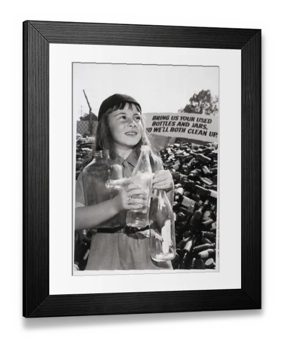 Framed Print : Girl Holds Bottles Stands By Bottle Pile Framed Print : Girl Holds Bottles Stands By Bottle Pile