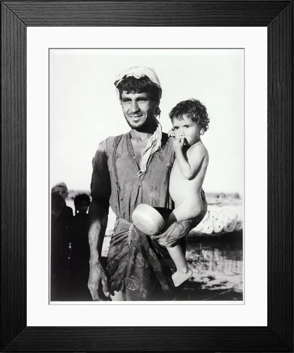 Framed Print : Iraqi Father Holding His Young Son Framed Print : Iraqi Father Holding His Young Son
