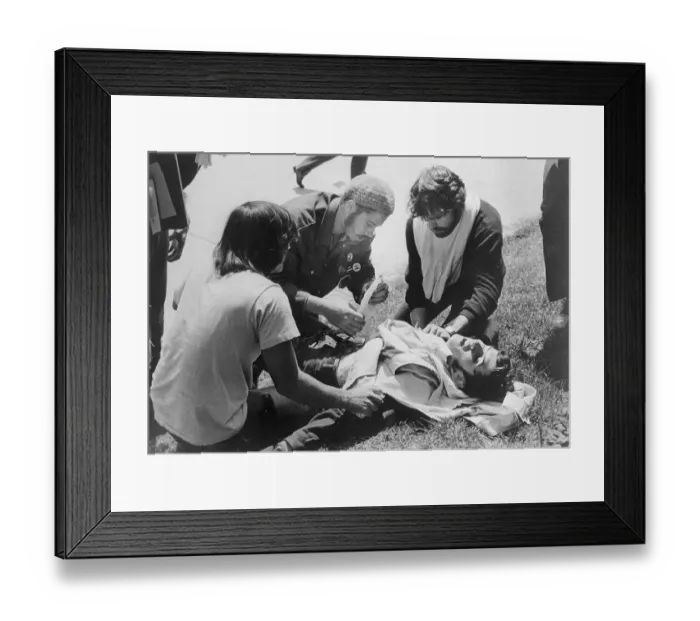 Framed Print : Students Giving First Aid to a Demonstrator