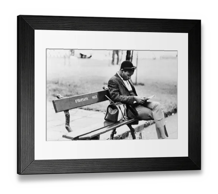 Framed Print : Man Sitting on Europeans Only Bench Framed Print : Man Sitting on Europeans Only Bench