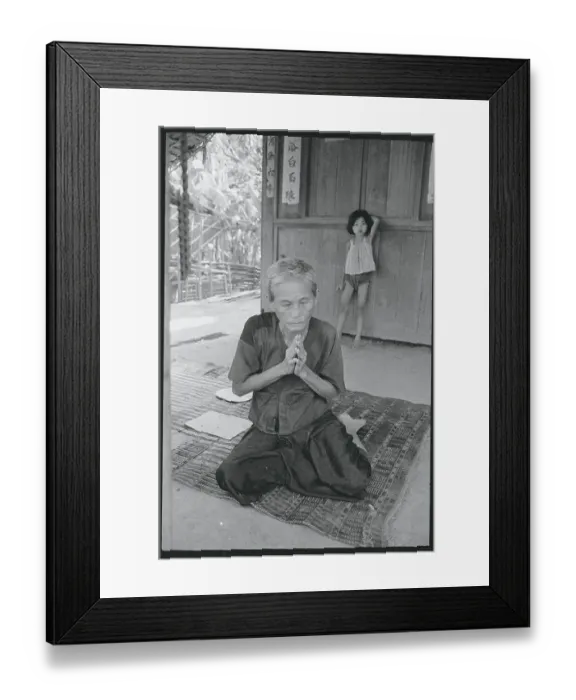 Framed Print : Elderly Woman Praying in Front of Home Framed Print : Elderly Woman Praying in Front of Home