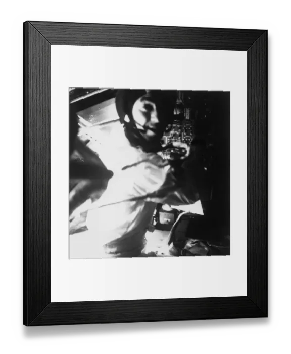 Framed Print : Apollo 13 astronaut, Fred Haise, is shown at the controls of teh lunar