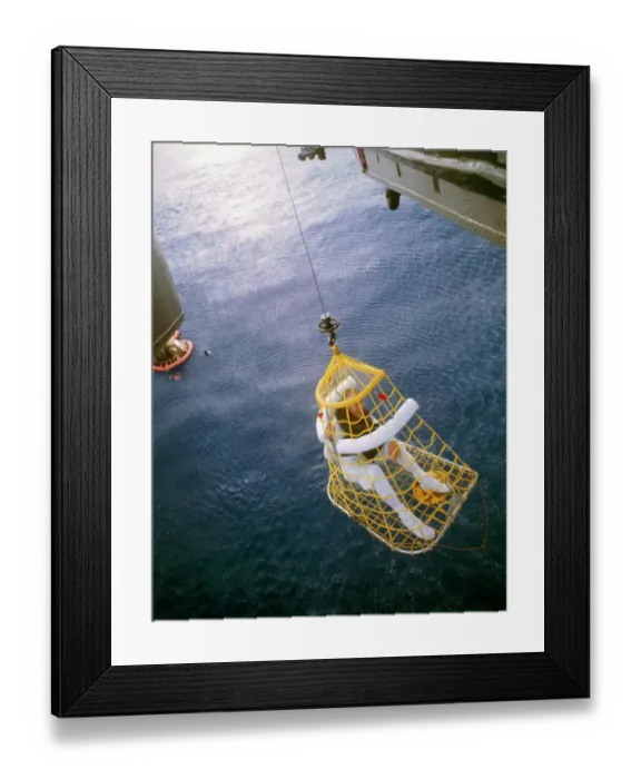 Framed Print : James A. Lovell Riding in a Rescue Basket Framed Print : James A. Lovell Riding in a Rescue Basket