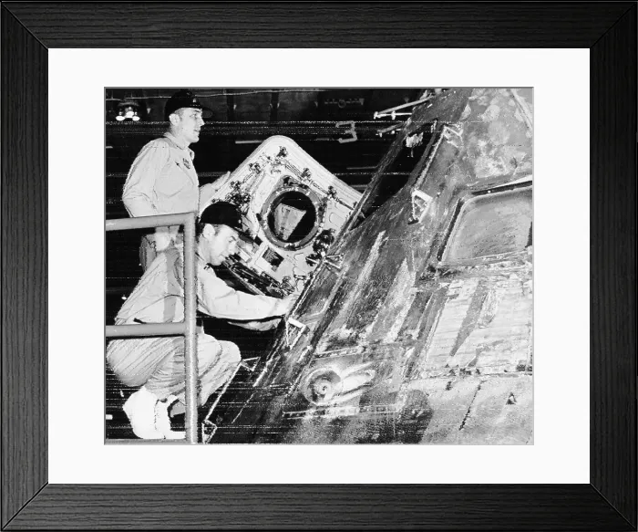 Framed Print : Apollo 13 astronauts Swigert and Lovell look over command module Framed Print : Apollo 13 astronauts Swigert and Lovell look over command module