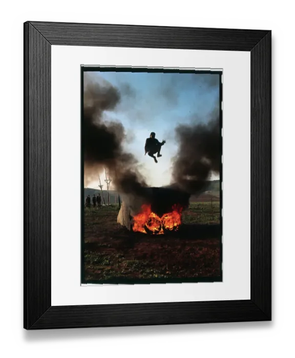 Framed Print : Youngster Jumping Over a Fire Framed Print : Youngster Jumping Over a Fire