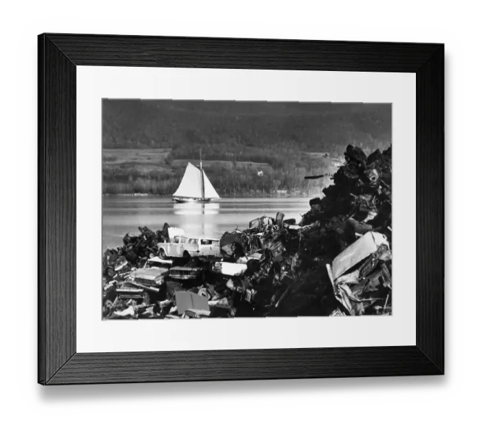 Framed Print : Sloop Sails Past Junkyard Framed Print : Sloop Sails Past Junkyard