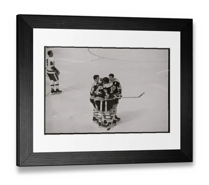 Framed Print : Hockey Players Embracing on Ice