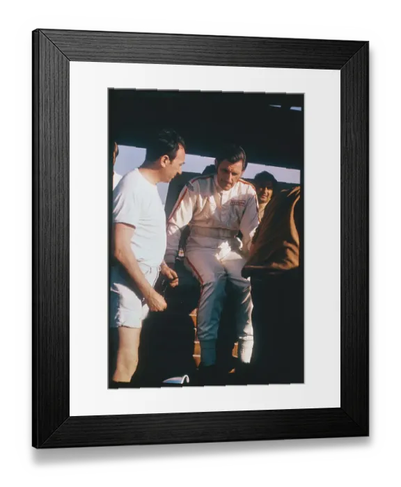 Framed Print : Graham Hill Talking to Pit Mechanic