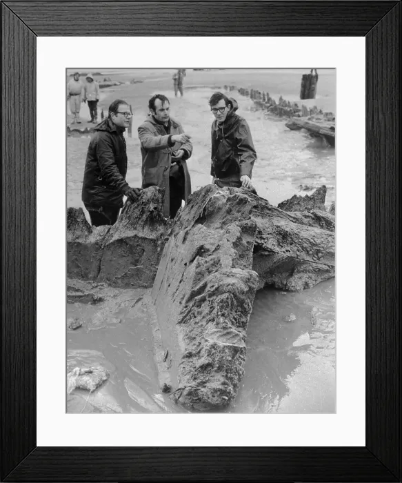 Framed Print : Men Standing over Finds Framed Print : Men Standing over Finds