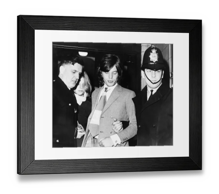 Framed Print : Policemen Escorting Mick Jagger and Girlfriend Framed Print : Policemen Escorting Mick Jagger and Girlfriend