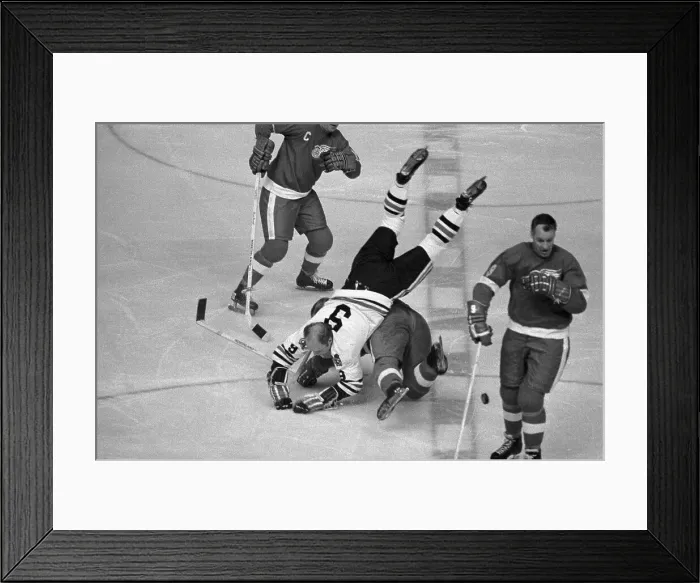 Framed Print : Player Gets Overturned in Hockey Game Framed Print : Player Gets Overturned in Hockey Game