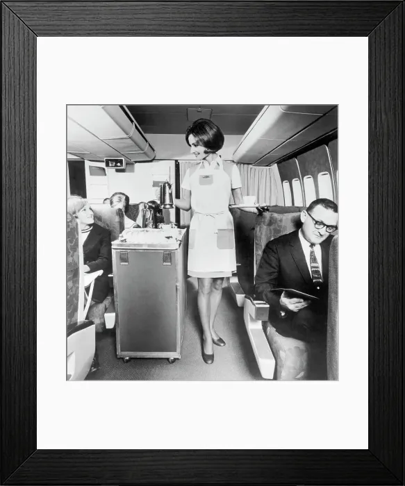 Framed Print : Flight Attendant Serving Coffee Framed Print : Flight Attendant Serving Coffee