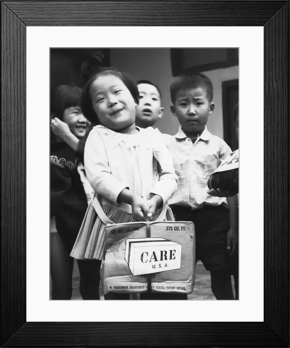 Framed Print : Korean Girl with Care Package Smiling Framed Print : Korean Girl with Care Package Smiling