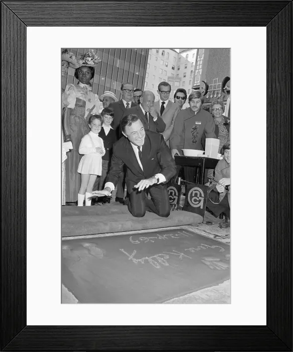 Framed Print : Gene Kelly Puts His Handprints In Cement Framed Print : Gene Kelly Puts His Handprints In Cement