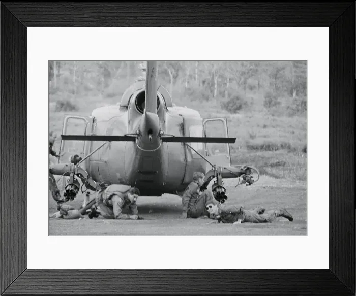 Framed Print : Soldiers Taking Refuge Under Helicopter Framed Print : Soldiers Taking Refuge Under Helicopter