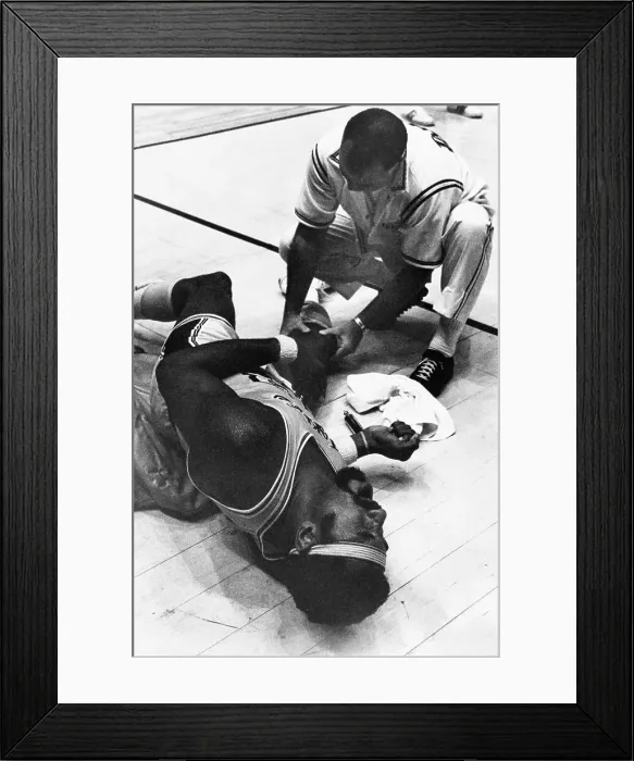 Framed Print : Wilt Chamberlain Lays On The Court In Pain
