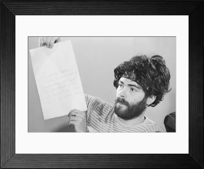 Framed Print : Jerry Rubin Holds Note From Bobby Seale Framed Print : Jerry Rubin Holds Note From Bobby Seale