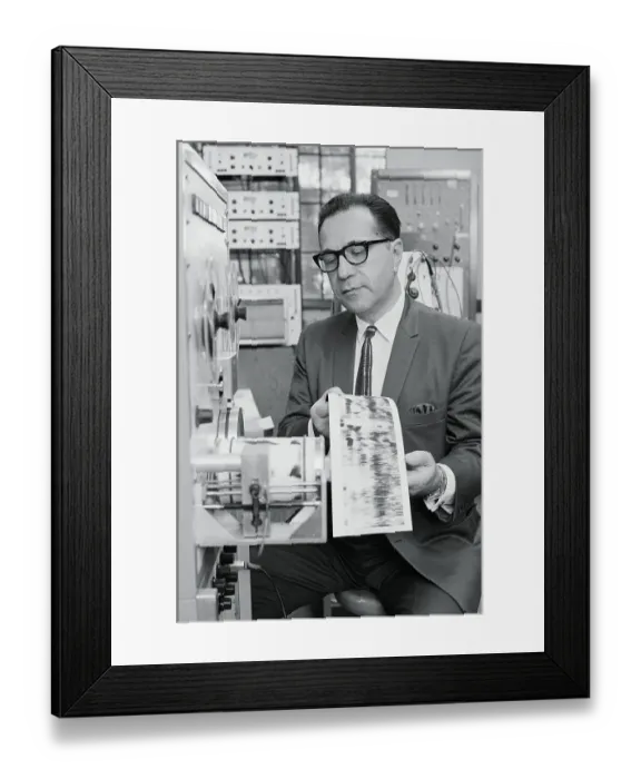 Framed Print : Audiologist Comparing Recordings Framed Print : Audiologist Comparing Recordings