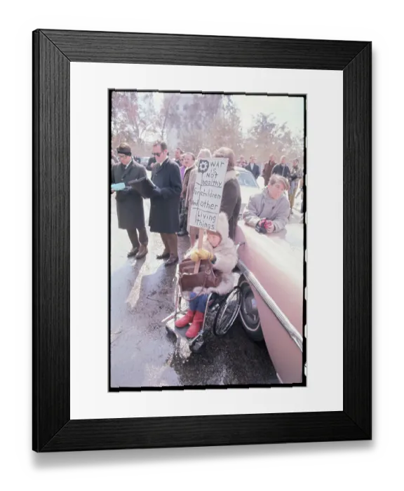 Framed Print : Girl in Wheelchair Holding Anti-War Sign Framed Print : Girl in Wheelchair Holding Anti-War Sign