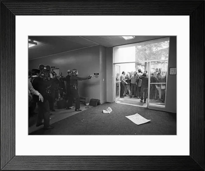 Framed Print : Policeman Points Revolver at Students Framed Print : Policeman Points Revolver at Students