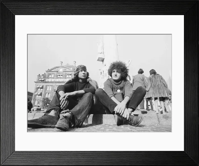 Framed Print : Hippie Men Seated in Town Square Framed Print : Hippie Men Seated in Town Square