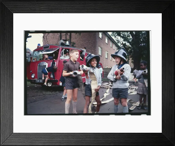 Framed Print : Youngsters Playing with Fire Hoses Framed Print : Youngsters Playing with Fire Hoses