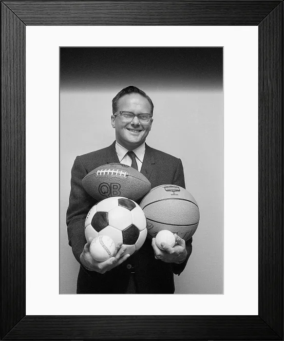 Framed Print : Lamar Hunt Holding Various Sports Balls Framed Print : Lamar Hunt Holding Various Sports Balls