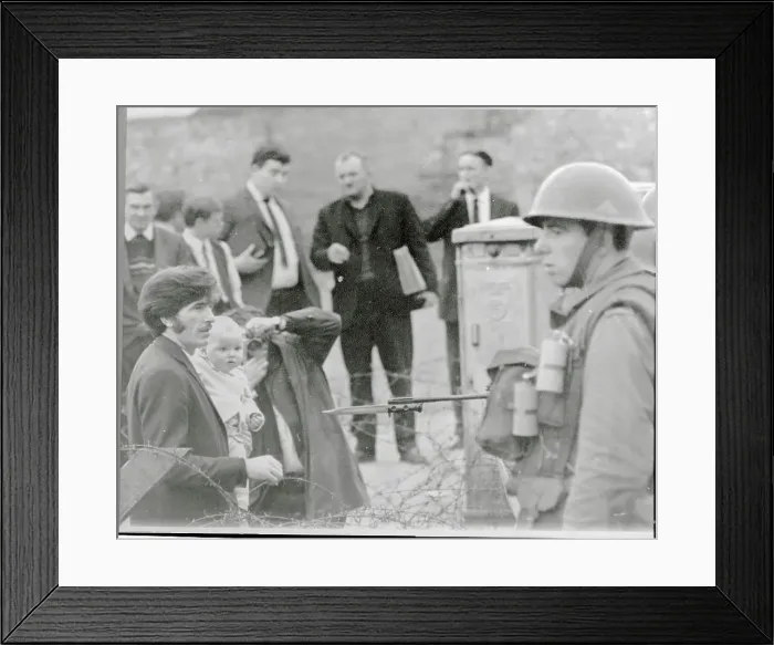 Framed Print : Soldier Pointing Bayonet at Father and Baby Framed Print : Soldier Pointing Bayonet at Father and Baby