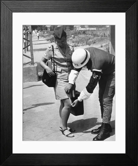 Framed Print : Military Police Measuring Woman'S Skirt Framed Print : Military Police Measuring Woman'S Skirt