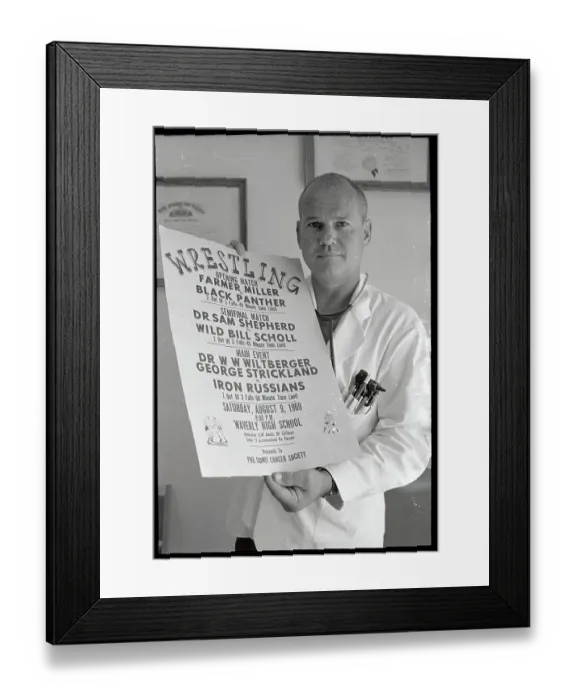 Framed Print : Sam Sheppard Holding Poster Framed Print : Sam Sheppard Holding Poster