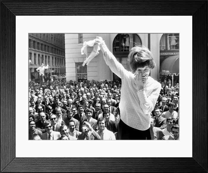 Framed Print : Woman Holds Up Brassiere Framed Print : Woman Holds Up Brassiere