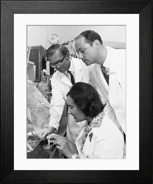 Framed Print : Woman Removing Grown Skin from Jar Framed Print : Woman Removing Grown Skin from Jar