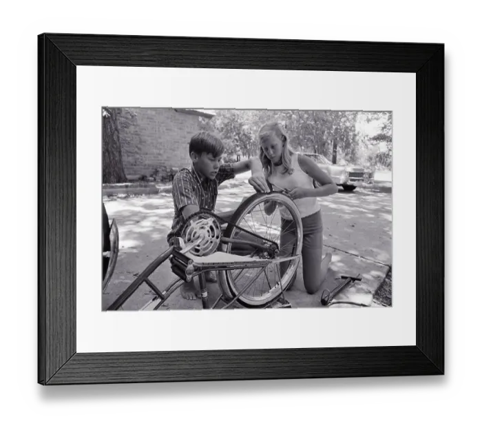 Framed Print : Astronaut Buzz Aldrin's Children Working on Bicycle Framed Print : Astronaut Buzz Aldrin's Children Working on Bicycle