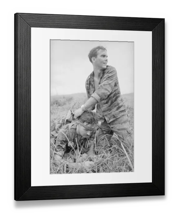 Framed Print : Soldier Putting a Bandage on Comrade's Head Framed Print : Soldier Putting a Bandage on Comrade's Head