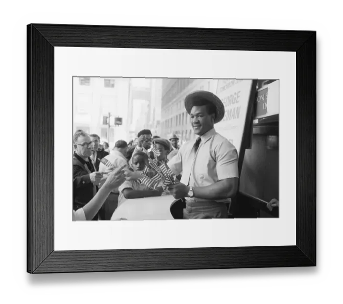 Framed Print : George Foreman Passes Out US Flags Framed Print : George Foreman Passes Out US Flags