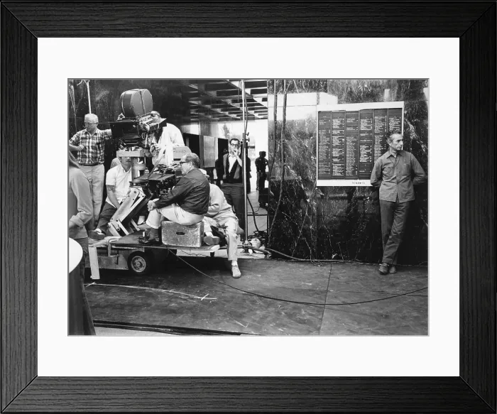 Framed Print : Michelangelo Antonioni Waiting with Film Crew in Lobby Framed Print : Michelangelo Antonioni Waiting with Film Crew in Lobby