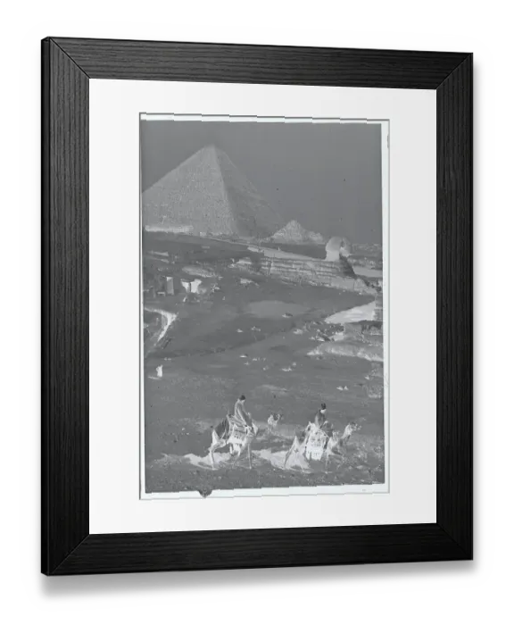 Framed Print : People Riding Camels with Pyramids and Sphinx in Background