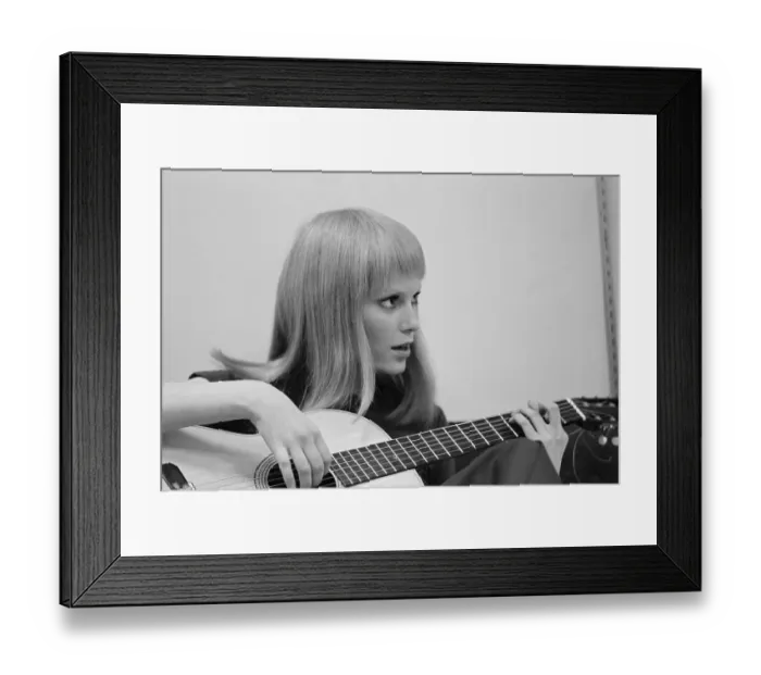 Framed Print : Profile of Mia Farrow Sitting on Street Playing Guitar Framed Print : Profile of Mia Farrow Sitting on Street Playing Guitar