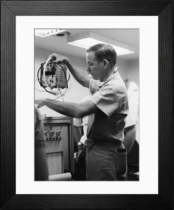 Framed Print : Cardiologist Lifting Heart Replacement Machine Framed Print : Cardiologist Lifting Heart Replacement Machine