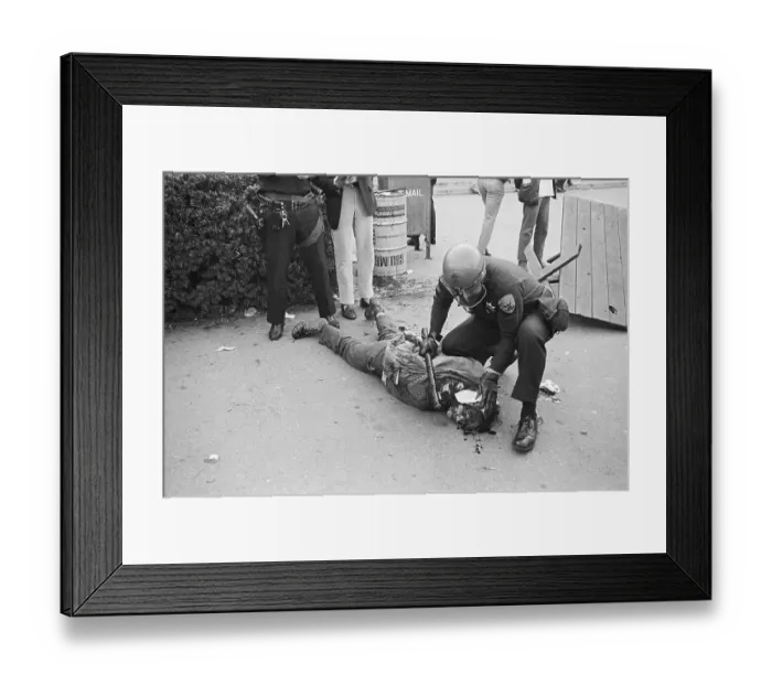 Framed Print : Protester Lying Injured on Sidewald Framed Print : Protester Lying Injured on Sidewald