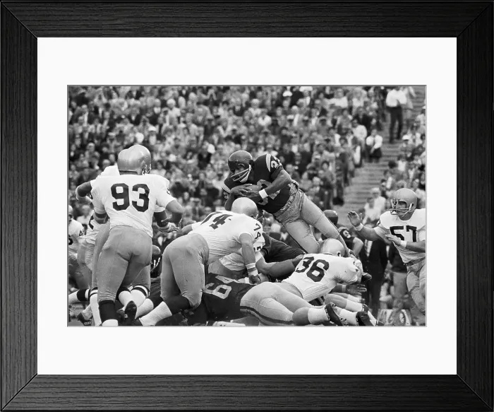 Framed Print : O.J. Simpson in Air as He Jumps over Offensive Line Framed Print : O.J. Simpson in Air as He Jumps over Offensive Line