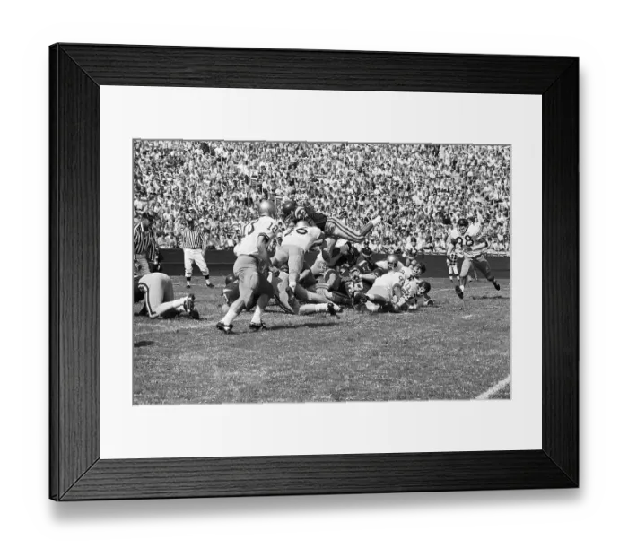 Framed Print : O.J. Simpson Goes Over Opposing Team Framed Print : O.J. Simpson Goes Over Opposing Team