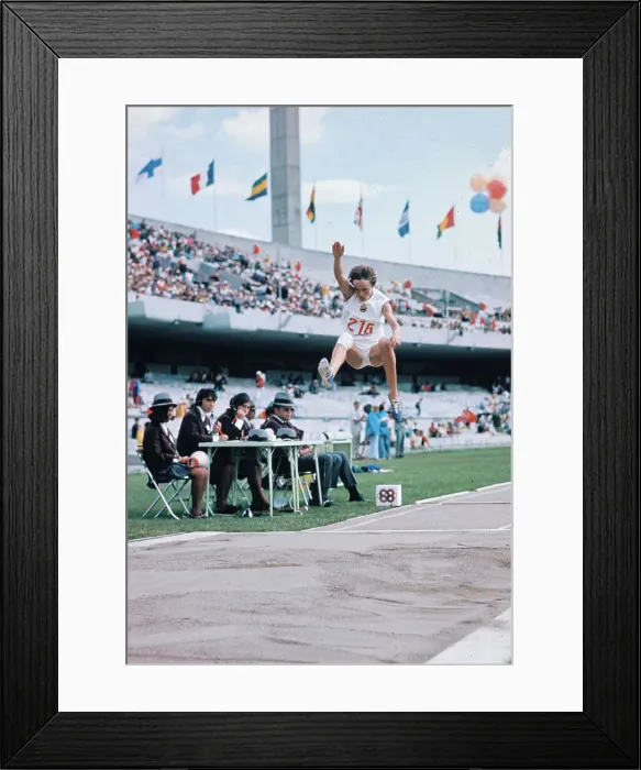 Framed Print : Athlete Performing the Long Jump