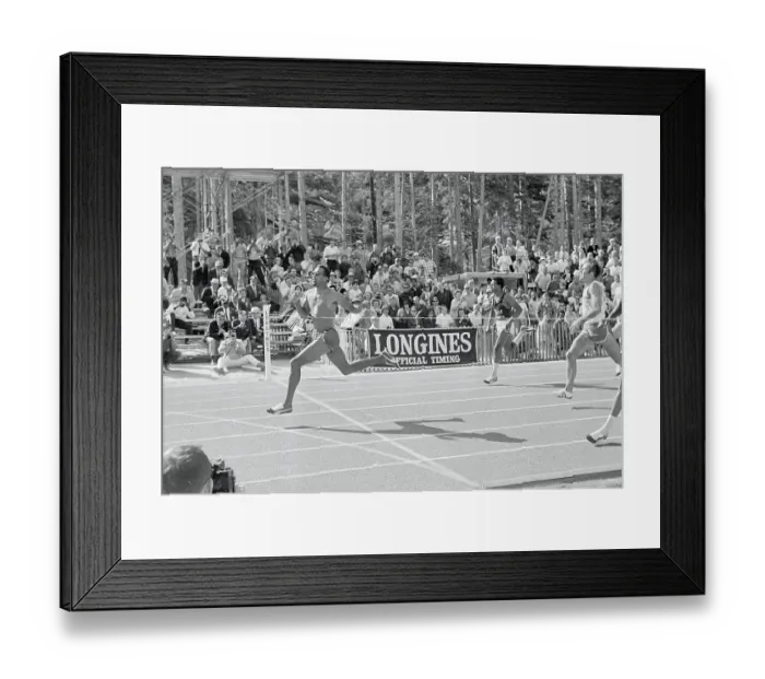 Framed Print : John Carlos Crossing Finish Line
