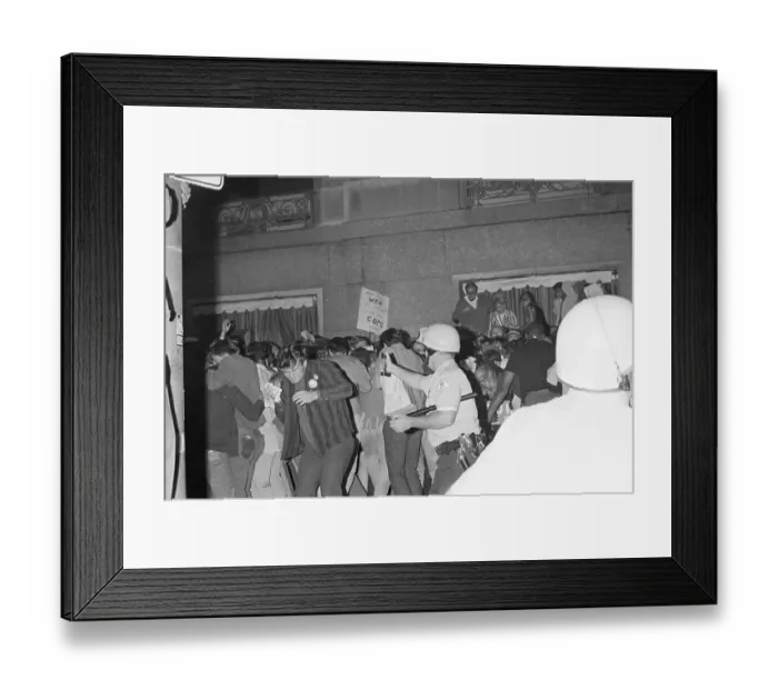 Framed Print : Policeman Macing Crowd Framed Print : Policeman Macing Crowd