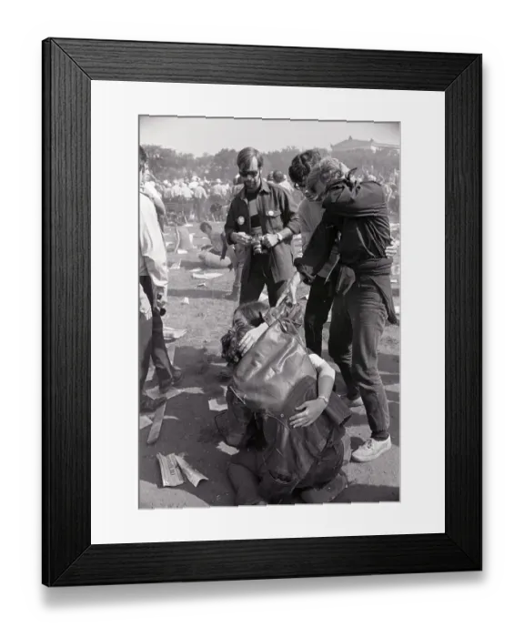 Framed Print : Injured Demonstrator Helped By Girl Framed Print : Injured Demonstrator Helped By Girl