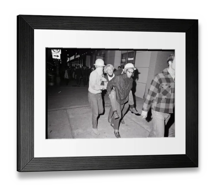 Framed Print : Men Carrying Fellow Protester Framed Print : Men Carrying Fellow Protester