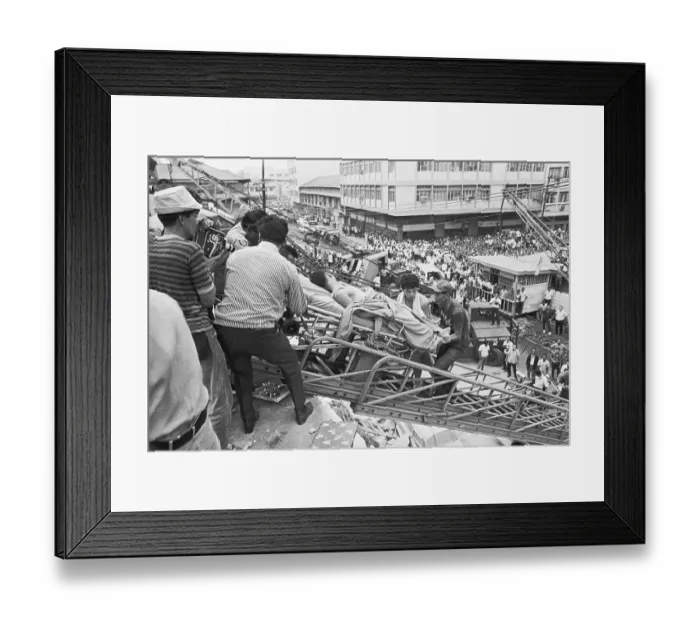 Framed Print : Rescuers Carry Quake Victim Down Ladder Framed Print : Rescuers Carry Quake Victim Down Ladder