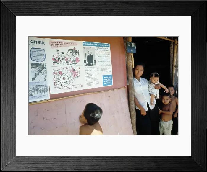 Framed Print : Boy Looking At Posters Framed Print : Boy Looking At Posters