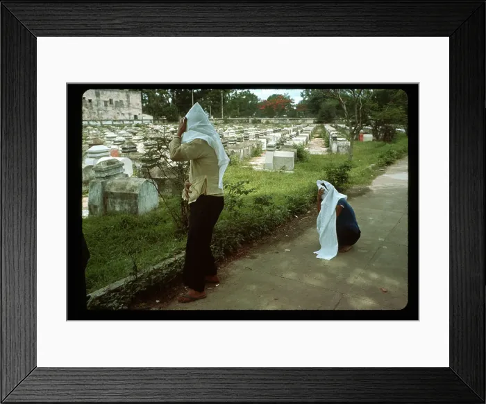 Framed Print : People at Fence of Cemetery